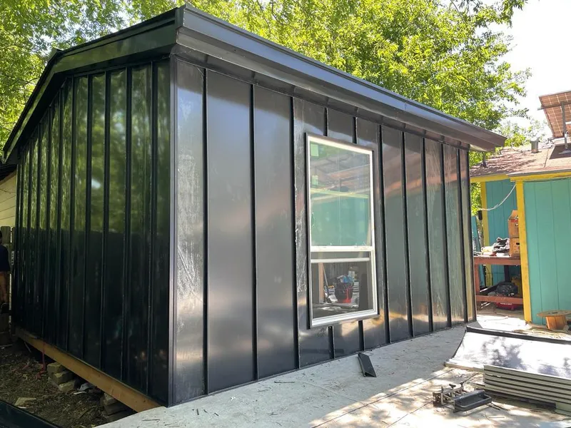 Black standing seam metal wall panels for Roof Inspection in Lakeland Village