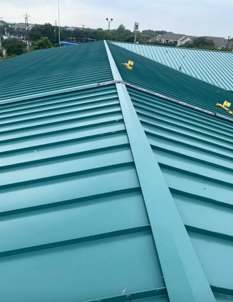 Green commercial metal roof ridge and valley for Metal Roof Repair in Lakeland Village